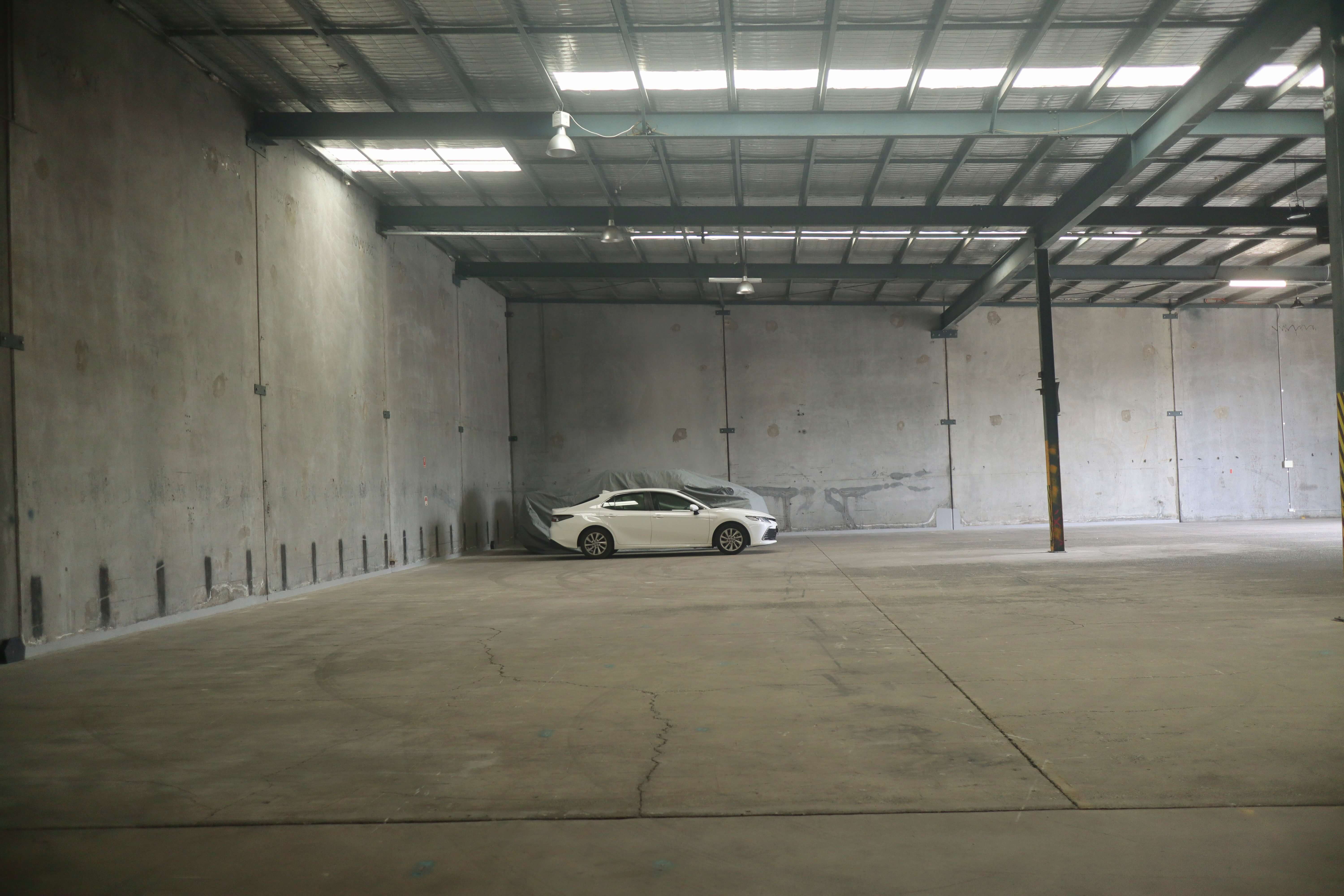 Picture shows cars parked in our car storage facility on the gold coast and also shows the space currently available inside our warehouse space.